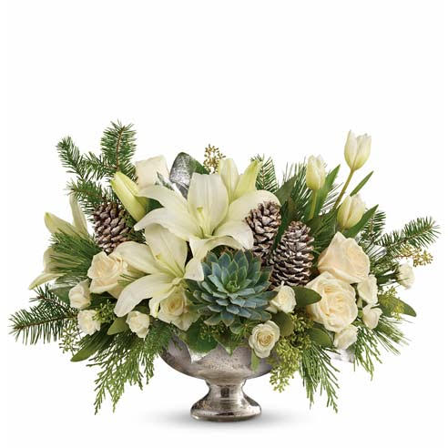 white flowers with greenery and pinecones in pedestal container