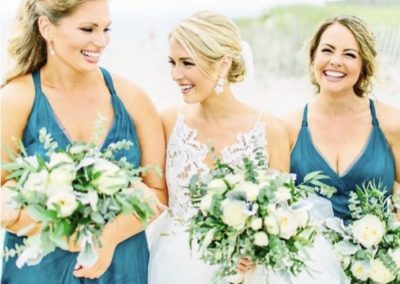 bridal party with three bouquets