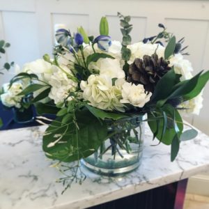 winter snow arrangement in clear glass vase