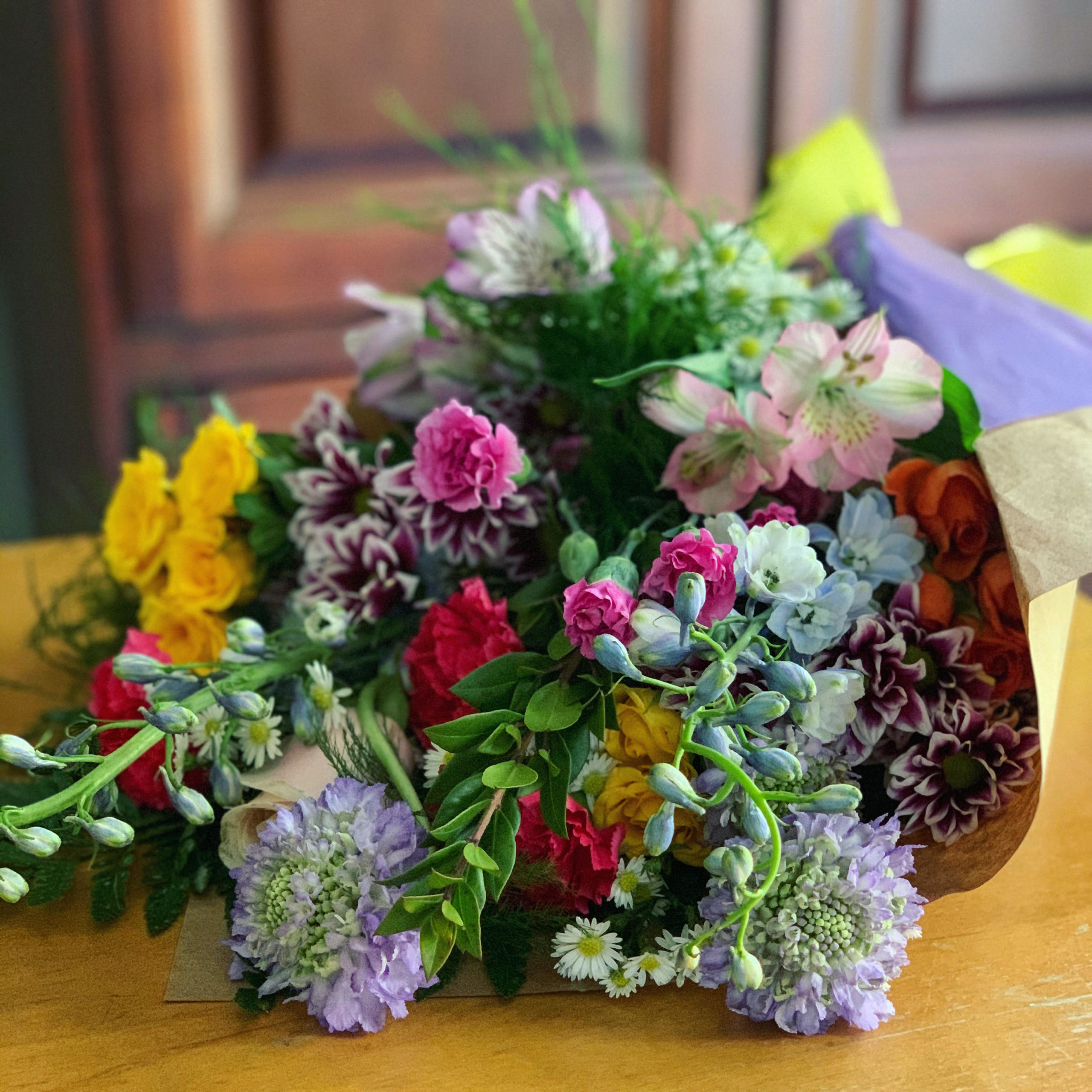 bouquet of bright flowers wrapped